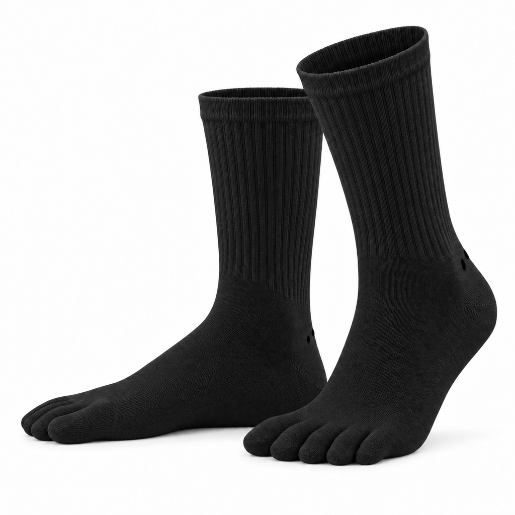 A pair of Albalana Crew merino toe socks in black, seen from the side on a white background