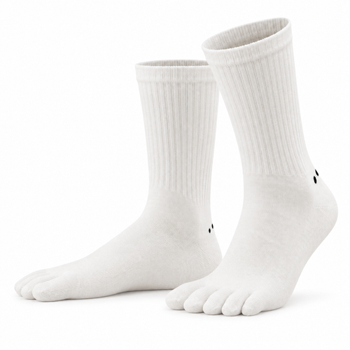 A pair of Albalana Crew merino toe socks in white, seen from the side on a white background