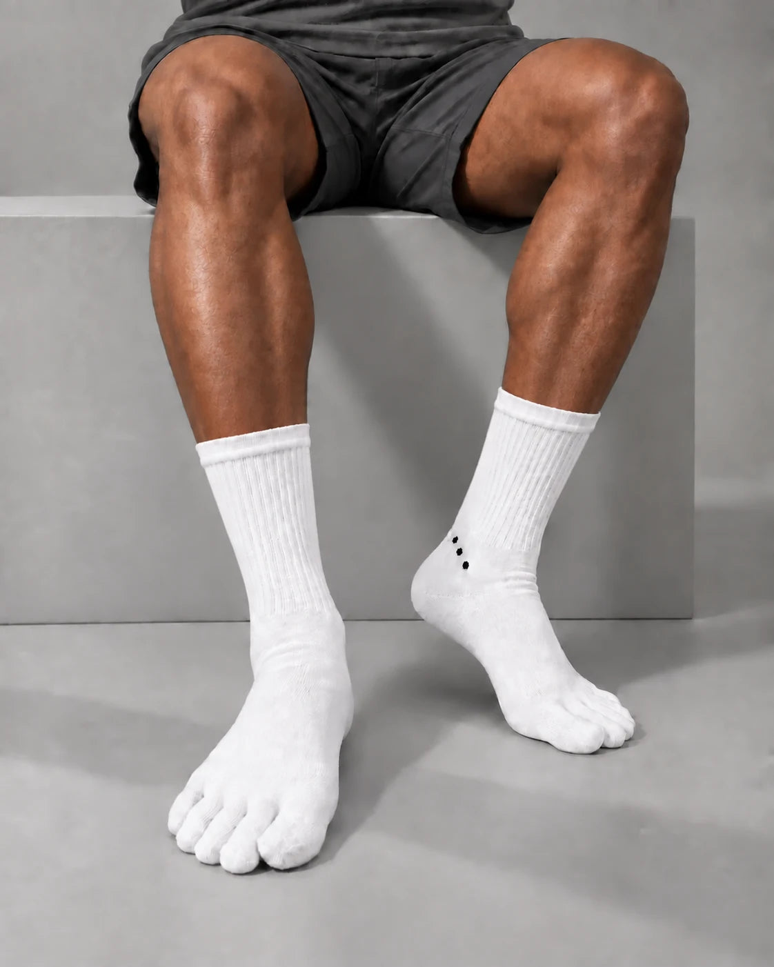 White Crew merino toe socks worn with grey training shorts.